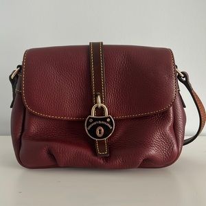 Dooney & Bourke Leather purse in burgundy.